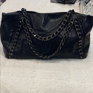 AUTHENTIC Chanel East West bag. Black caviar leather with black tone hardware.